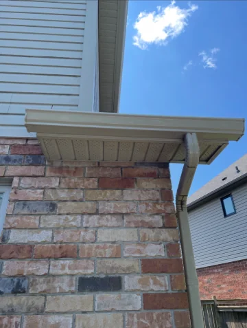 The same exterior gutter face after cleaning